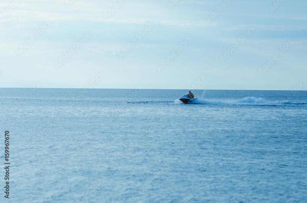 Resort vacation. Jet ski in the sea at sunset