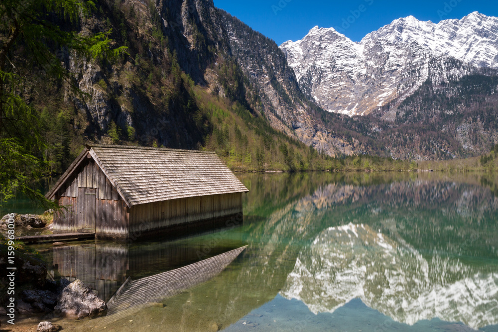 Boat house on lake Obersee with beautiful reflections Boat house on lake Obersee with beautiful reflections