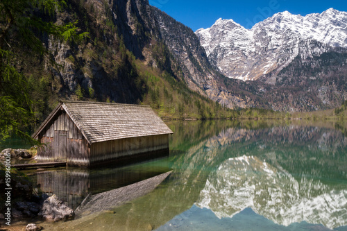 Boat house on lake Obersee with beautiful reflections