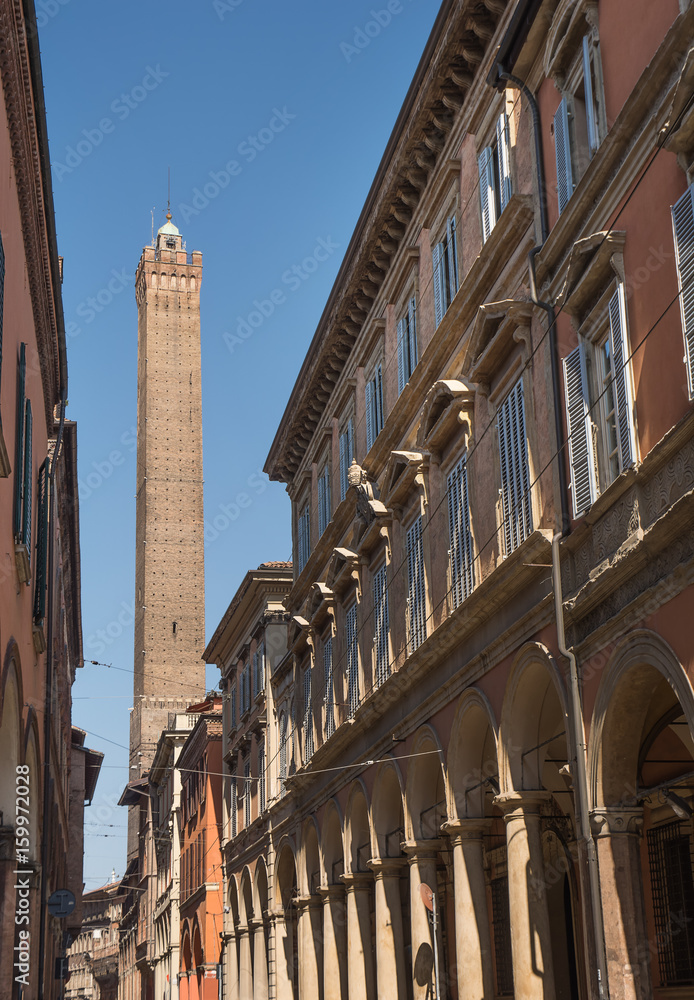 Tower of the Asinelli view from the Strada Maggiore of Bologna in a sunny day