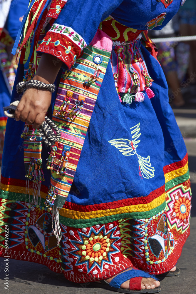 Detail of clothing worn by members of a Tinkus dancing group performing at the Carnaval Andino con la Fuerza del Sol in Arica, Chile.