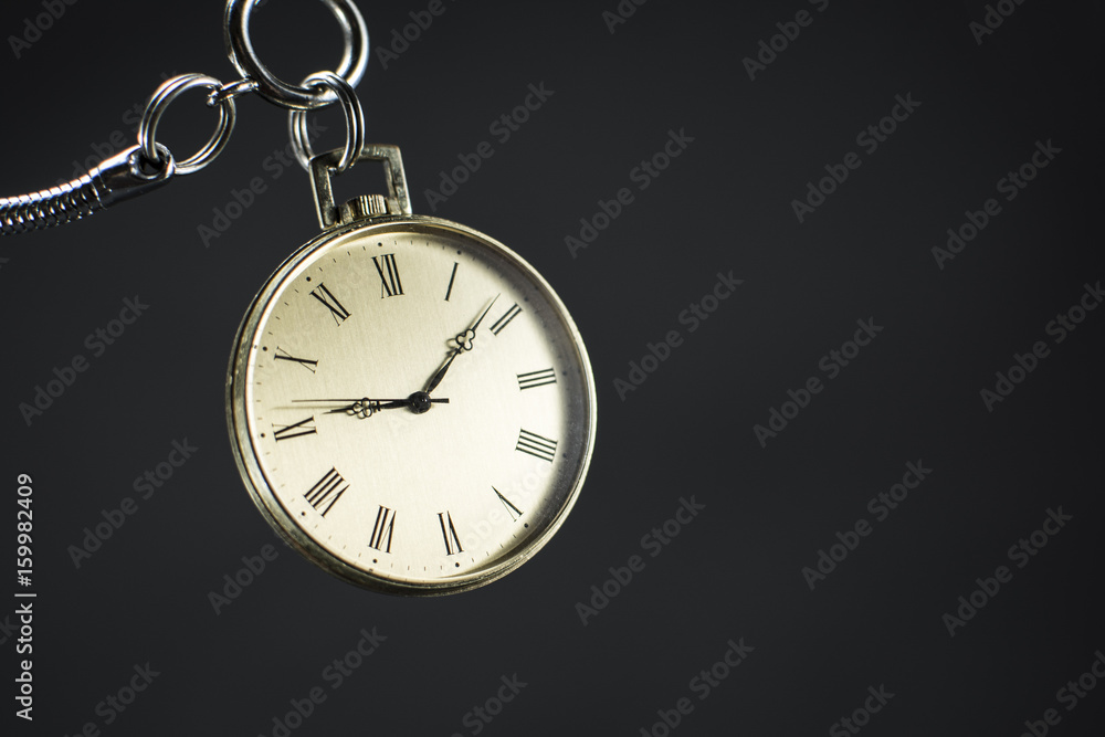 Close up of an old gold pocket watch. Beautiful antique watch isolated on black background. Close up of an old gold pocket watch. Beautiful antique watch isolated on black background.