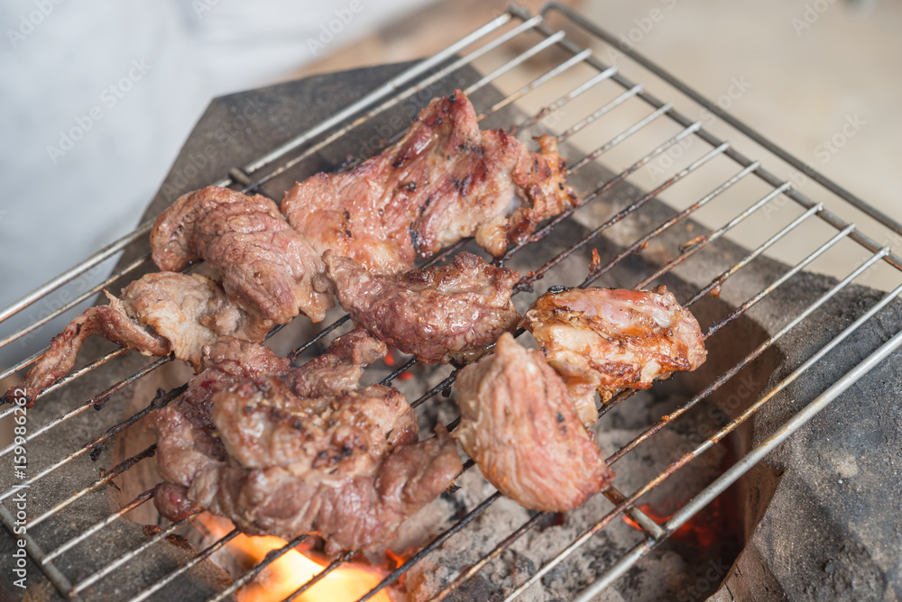 Grilled meat on a charcoal grill,fresh beef,selective focus