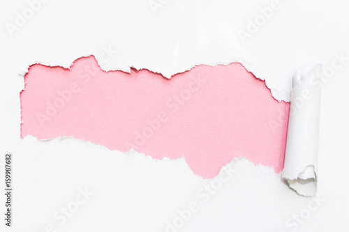 Pink hole in white paper. Empty space for text.