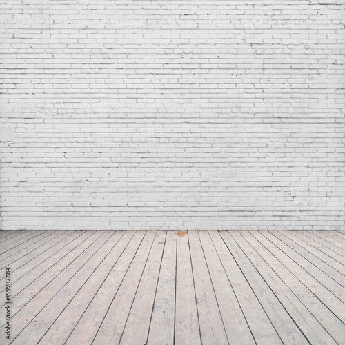 White brick wall and wood floor.