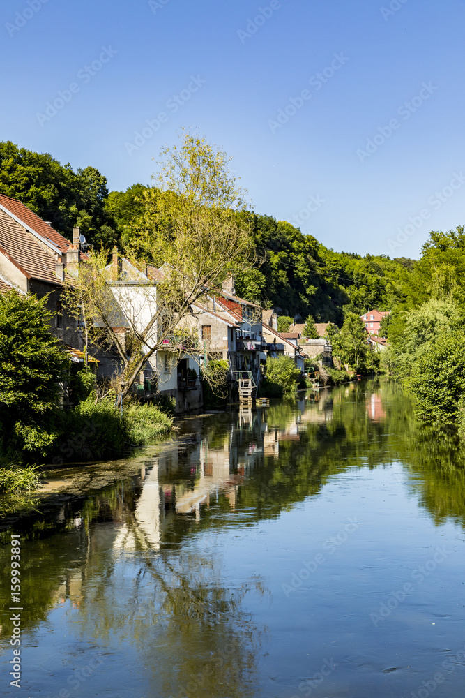 typical small village L-Isle-sur-le-Doubs in France with river Doubs typical small village L-Isle-sur-le-Doubs in France with river Doubs