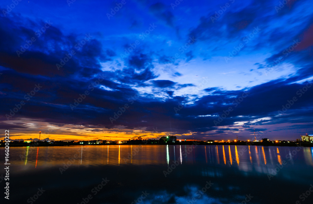 Fototapeta premium Long exposure view dam and city on sunset,vivid,blurry