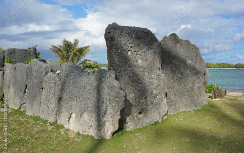 Large stone structure on the seashore, the marae Anini ancient religious sacred place on the south of the island of Huahine Iti, French Polynesia, south Pacific ocean photo