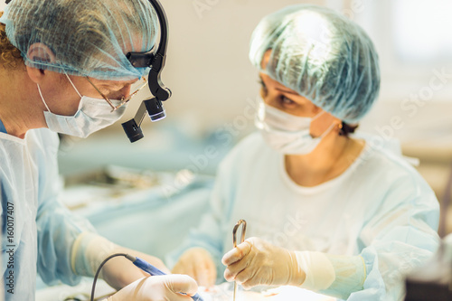 two surgeons at work in operating room. close up photo