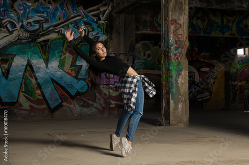Pretty female dancer in abandoned building © AntonioDiaz