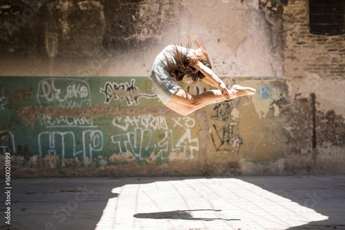 Pretty ballerina jumping and performing