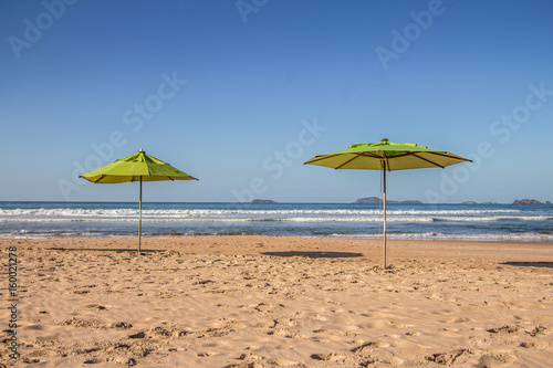 Geriba Beach in Buzios, Brazil. Two umbrellas © barkstudio
