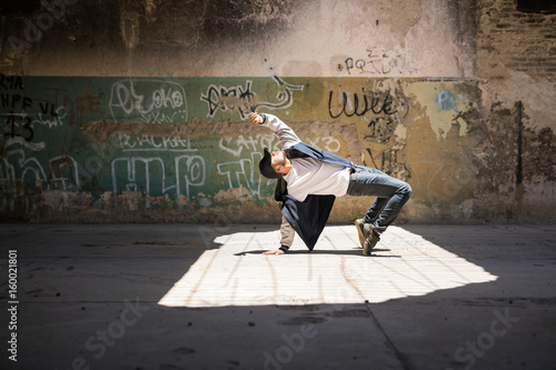 Breakdancer performing in an urban setting