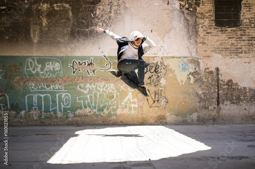Dancer jumping in urban setting