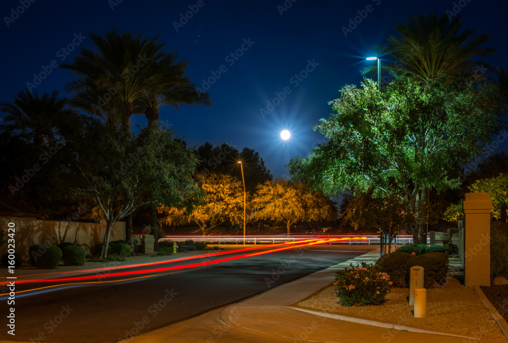Full moon with car light trails