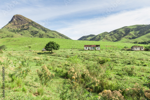 Abandoned farm in Brazil. Moutains and old house photo