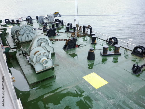 Mooring part of the barge deck. Babin with chains from the anchors. Mooring devices. Bitteng on the deck photo