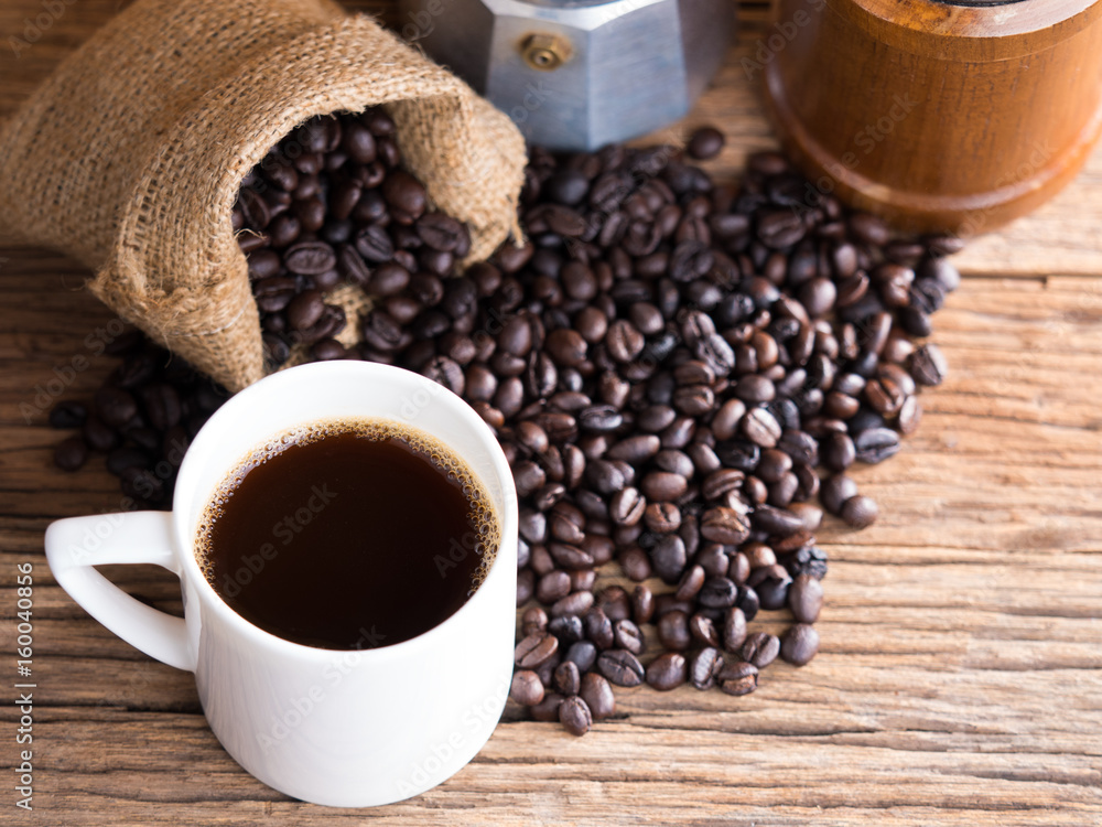 black roasted coffee beans on aged wood black roasted coffee beans on aged wood