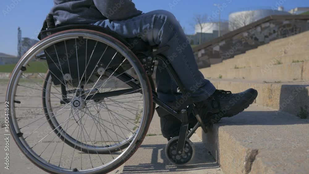 Disabled man in wheelchair Can not obstacle, Steps for