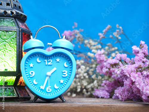 vintage alarn clock on wooden background photo