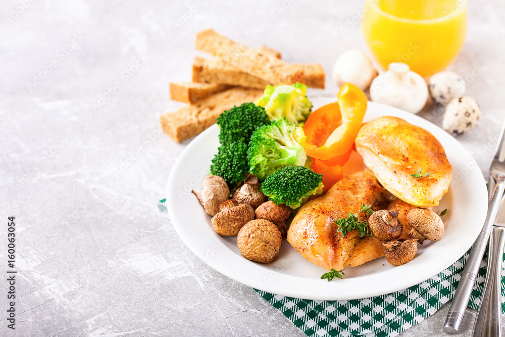 Healthy lunch - chicken fillet, mushrooms, broccoli and paprika. Selective focus. Copy space Healthy lunch - chicken fillet, mushrooms, broccoli and paprika. Selective focus. Copy space