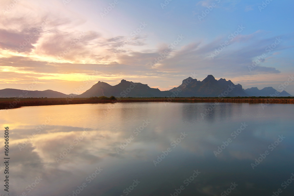 Beautiful natural of the colorful sky and beautiful water reflection,during the time sunrise at Khao Sam Roi Yot National Park,Prachuap Khiri Khan Province in Thailand. Travel and natural Concept