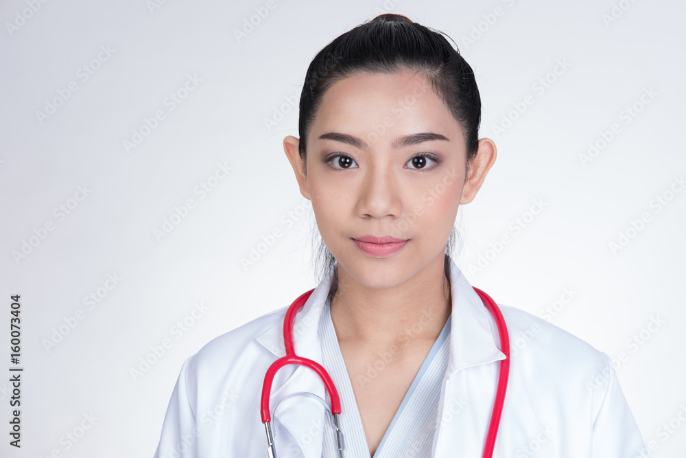 Confident smiling female doctor posing and looking at camera. Portrait of a young medical staff with positive attitude. physician or practitioner on white background Confident smiling female doctor posing and looking at camera. Portrait of a young medical staff with positive attitude. physician or practitioner on white background