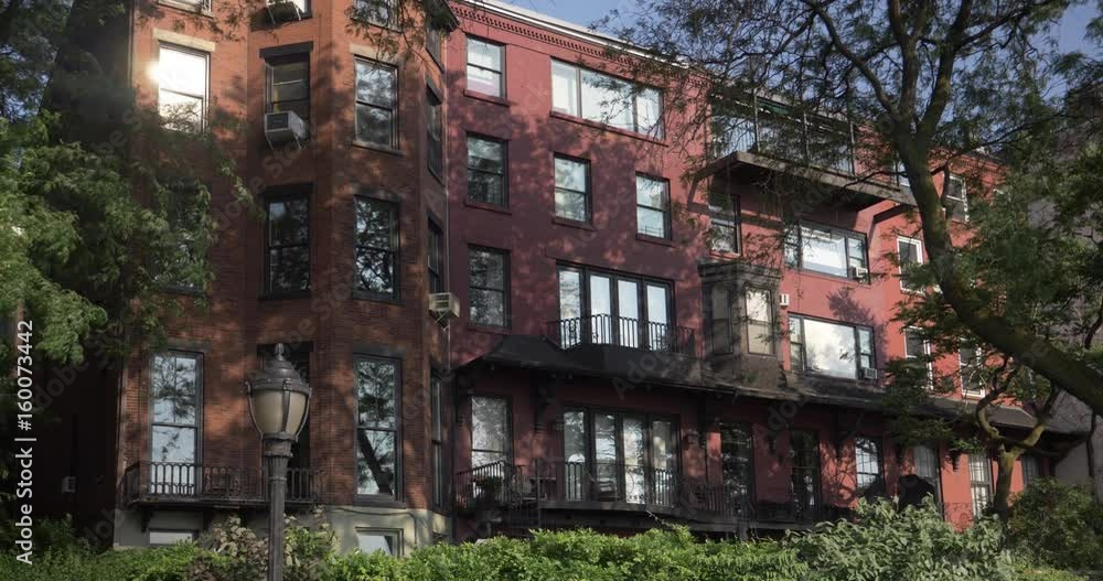 A daytime exterior establishing shot of an upscale apartment building in Brooklyn. A daytime exterior establishing shot of an upscale apartment building in Brooklyn.