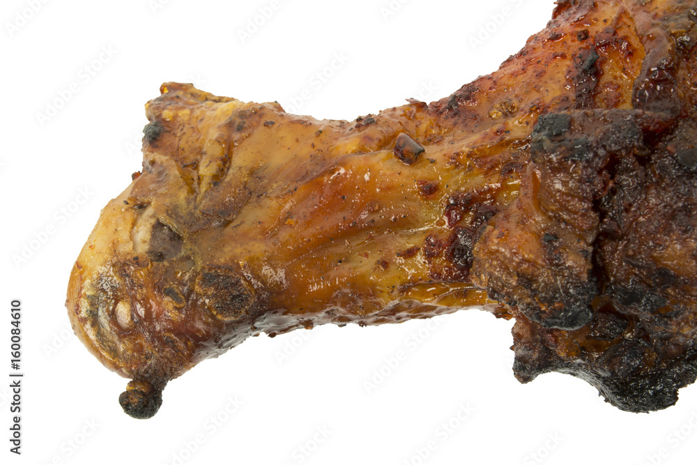 Close up of grilled Chicken drumstick, leg on white background. Bone in and skin on. Great for texture and 3d models. Narrow Aperture shot especially for texture use.