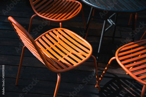Orange chairs in dark scene