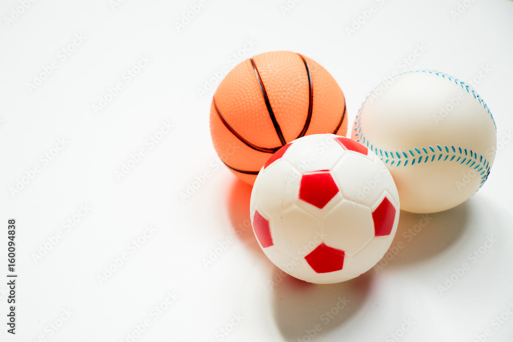 Group of football, baseball and basketball placed on white background