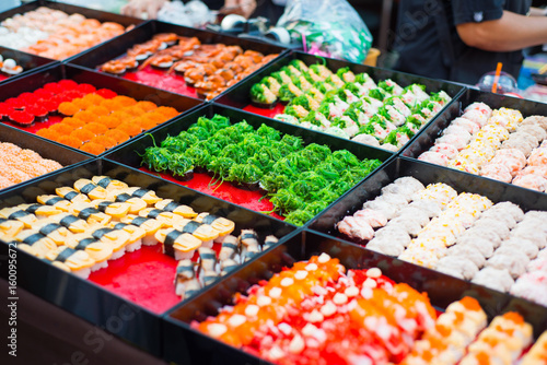 various sushi rolls for sale in market