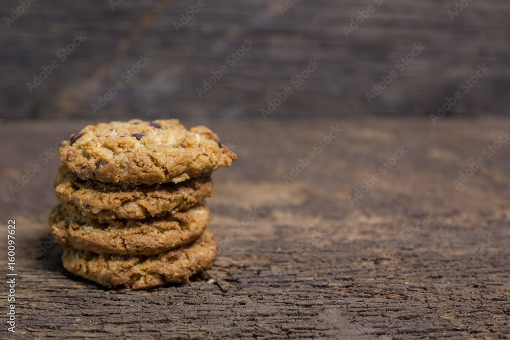 oat and Chocolate chip cookies on rustic wooden table background oat and Chocolate chip cookies on rustic wooden table background