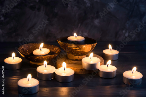 Many burning candles in dark background in concept spa relaxing , holiday ,merry christmas, REST IN PEACE