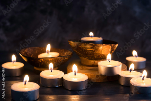 Many burning candles in dark background   in concept spa relaxing , holiday ,merry christmas, REST IN PEACE