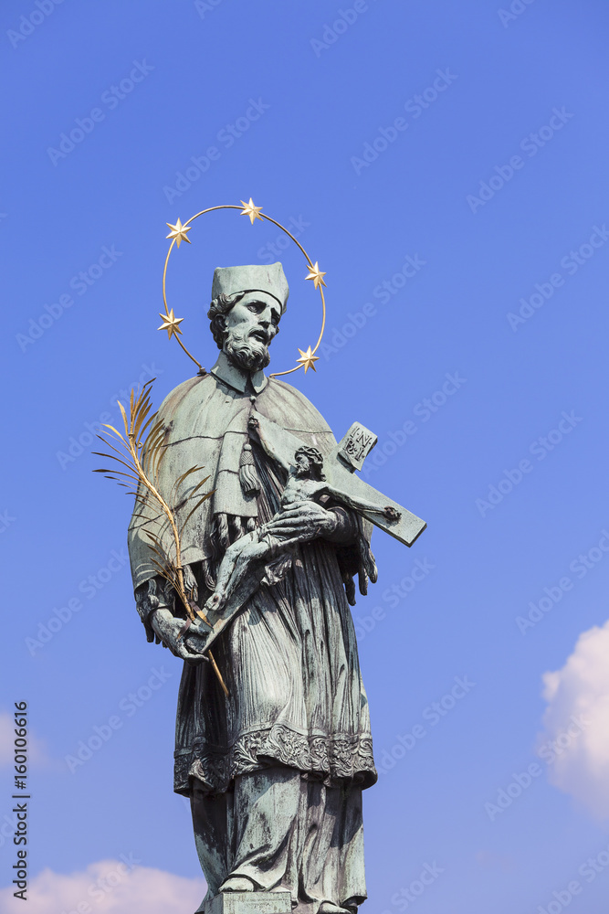 Statue of St John Nepomucene with crucifix in hand, Charles Bridge, Prague, Czech Republic