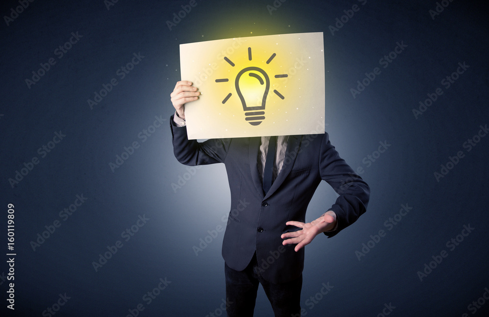 Businessman holding paper with lightbulb Businessman holding paper with lightbulb