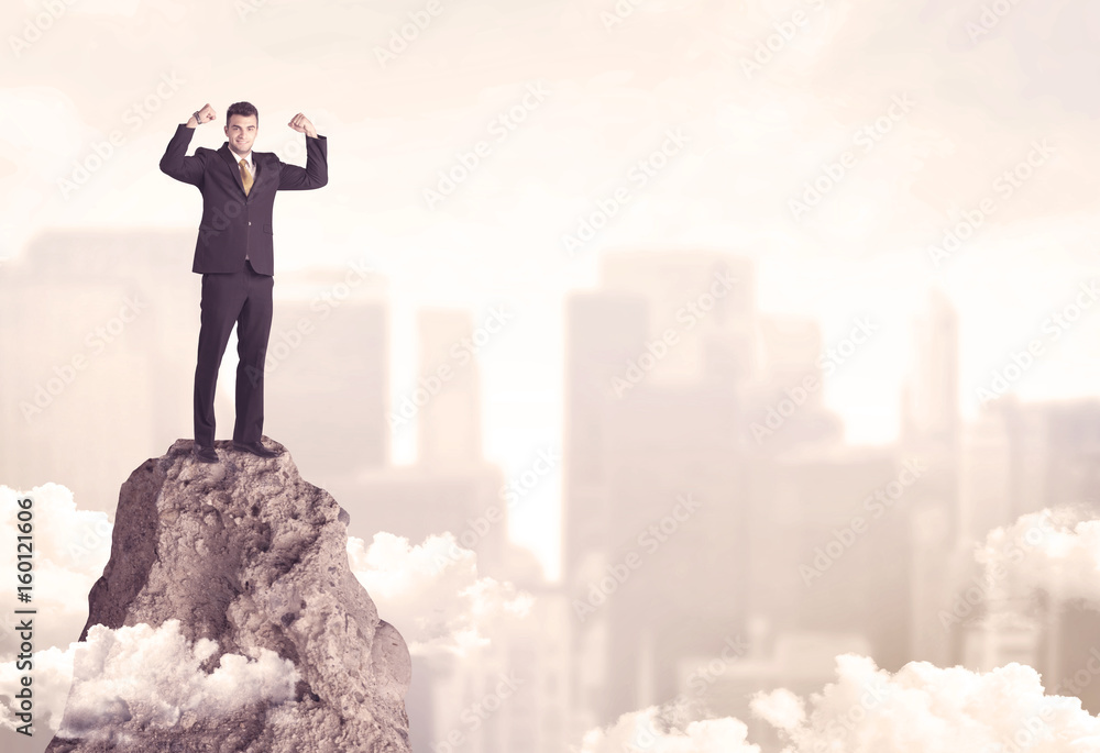 Confident businessman on dangerous cliff Confident businessman on dangerous cliff