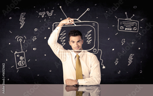 Happy businessman drawing tv and radio photo