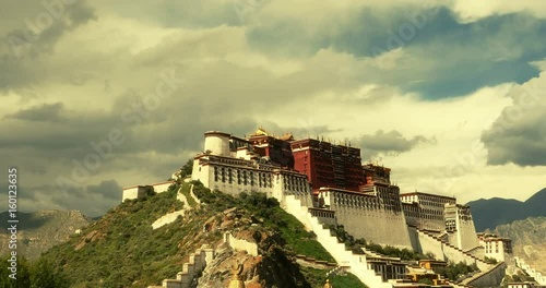 4k Potala in Lhasa,Tibet,time lapse of white puffy cloud mass in the blue sky. photo