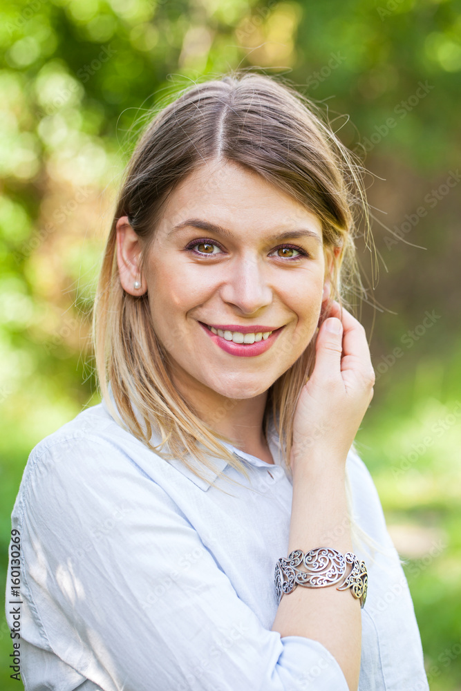 Beautiful casual woman posing outdoor