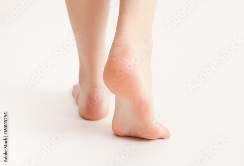 Feet of a walking man with not groomed heels © ekramar