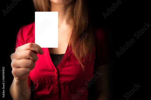 woman in red shirt with card © lijphoto