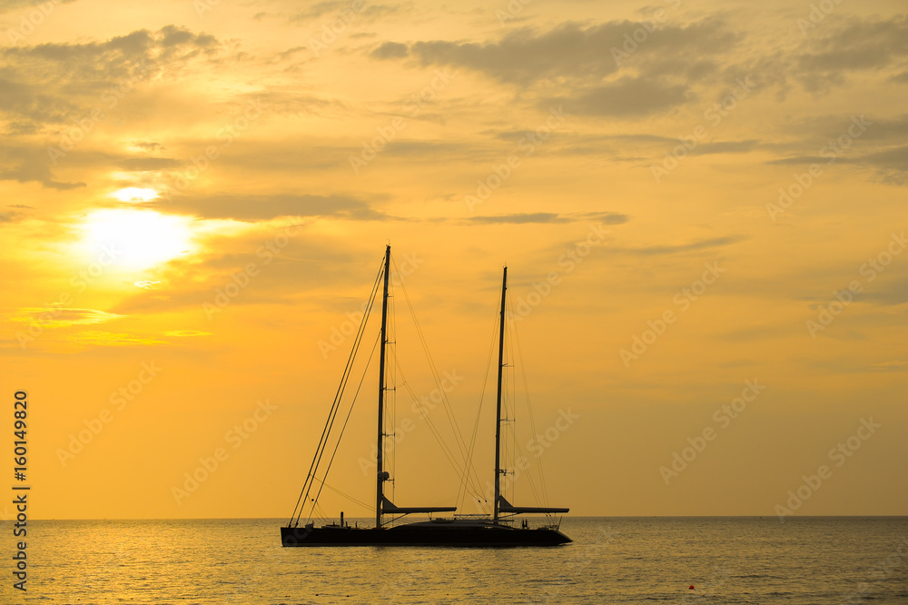 silhouette of sailing yacht in Beautiful Sunset at andaman sea