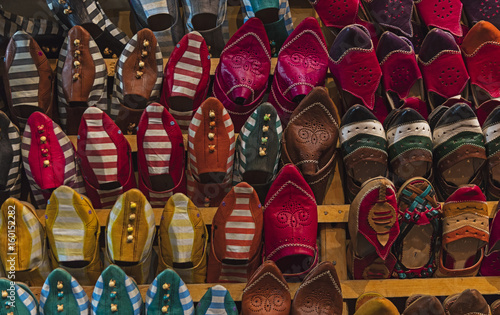 Typical colourful hand crafted leather slippers on display in the Fes Medina, Morocco