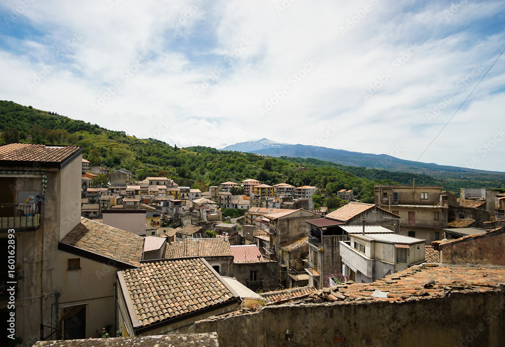 View of Etna volcano with a beautiful village Castiglione di Sicilia in the foreground. Italy.
