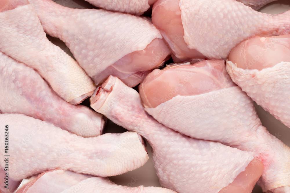 Fresh chicken leg, meat on plate.With spices. Fresh chicken leg, meat on plate.With spices.