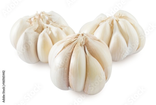 Three Garlic Bulbs and Garlic Cloves on White Background