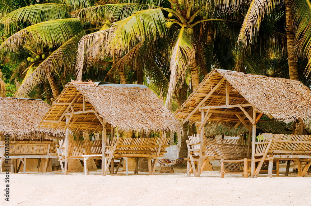 Summer sunshades and bamboo armchair on the tropical white sand beach, Summer sunshades and bamboo armchair on the tropical white sand beach,