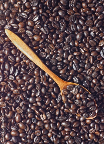Coffee beans with wooden spoon
